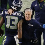 Seattle Seahawks head coach Pete Carroll embraces Seattle Seahawks wide receiver Chris Matthews (13) after Matthews made a touchdown catch against the New England Patriots during the first half of NFL Super Bowl XLIX football game Sunday, Feb. 1, 2015, in Glendale, Ariz. (AP Photo/Ross D. Franklin)