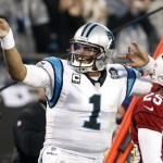 Carolina Panthers' Cam Newton (1) signals after making a first down against the Arizona Cardinals in the first half of an NFL wild card playoff football game in Charlotte, N.C., Saturday, Jan. 3, 2015. (AP Photo/Bob Leverone)