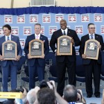 National Baseball Hall of Fame inductees, from left, Bobby Cox, Tony La Russa, Tom Glavine, Frank Thomas, Greg Maddux and Joe Torre hold their plaques after an induction ceremony at the Clark Sports Center on Sunday, July 27, 2014, in Cooperstown, N.Y. (AP Photo/Mike Groll)