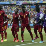 Ghana's Asamoah Gyan, center, celebrates with his teammates after scoring his side's second goal during the group G World Cup soccer match between Germany and Ghana at the Arena Castelao in Fortaleza, Brazil, Saturday, June 21, 2014. (AP Photo/Marcio Jose Sanchez)
