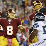 Washington Redskins quarterback Kirk Cousins (8) passes the ball during the first half of an NFL football game against the Seattle Seahawks in Landover, Md., Monday, Oct. 6, 2014. (AP Photo/Alex Brandon)