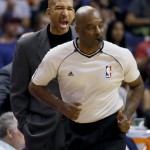 New Orleans Pelicans head coach Monty Williams yells at referee Haywoode Workman during the first half of an NBA basketball game against the Phoenix Suns, Thursday, March 19, 2015, in Phoenix. (AP Photo/Matt York)