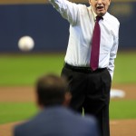 Former Major League Baseball commissioner Bud Selig throws out the first pitch before the start of an opening day baseball game between the Milwaukee Brewers and the Colorado Rockies Monday, April 6, 2015, in Milwaukee. (AP Photo/Darren Hauck)