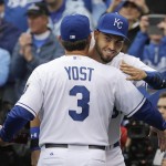 Kansas City Royals first baseman Eric Hosmer, right, gets a hug and an American League Championship ring from manager Ned Yost (3) before an opening day baseball game against the Chicago White Sox at Kauffman Stadium in Kansas City, Mo., Monday, April 6, 2015. (AP Photo/Orlin Wagner)