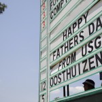 The scoreboard on the 18th hole wishes Louis Oosthuizen, of South Africa a happy Father's Day during the final round of the U.S. Open golf tournament in Pinehurst, N.C., Sunday, June 15, 2014. (AP Photo/David Goldman)