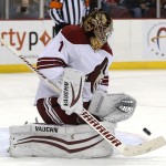 Phoenix Coyotes goalie Thomas Greiss, of Germany, makes a save on a shot by the New Jersey Devils during the second period of an NHL hockey game, Thursday, March 27, 2014, in Newark, N.J. (AP Photo/Julio Cortez)
