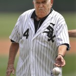  World War Two veteran Milton Greenfield throws out the ceremonial first pitch before a baseball game between the Chicago White Sox and Cleveland Indians in Chicago, Monday, May 26, 2014. (AP Photo/Paul Beaty)