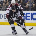  Los Angeles Kings defenseman Drew Doughty (8) and Phoenix Coyotes forward Brandon Mcmillan (38) tangle during the first period of an NHL hockey game, Wednesday, April 2, 2014, in Los Angeles. (AP Photo/Ringo H.W. Chiu)