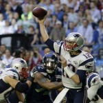 New England Patriots quarterback Tom Brady (12) throws a pass during the first half of NFL Super Bowl XLIX football game against the Seattle Seahawks Sunday, Feb. 1, 2015, in Glendale, Ariz. (AP Photo/David J. Phillip)