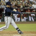  Milwaukee Brewers' Jonathan Lucroy connects for a grand slam against the Arizona Diamondbacks during the seventh inning of a baseball game on Tuesday, June 17, 2014, in Phoenix. (AP Photo/Ross D. Franklin)