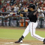 Arizona Diamondbacks' David Peralta connects for a home run against the St. Louis Cardinals during the first inning of a baseball game Saturday, Sept. 27, 2014, in Phoenix. (AP Photo/Ross D. Franklin)