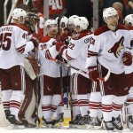 Arizona Coyotes center Mark Arcobello (36) celebrates with teammates after scoring against the Detroit Red Wings in overtime of an NHL hockey game in Detroit on Tuesday, March 24, 2015. Arizona won 5-4. (AP Photo/Paul Sancya)