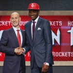 Clint Cappella, right, of France, poses for photos with NBA Commissioner Adam Silver after being selected 25th overall by the Houston Rockets during the 2014 NBA draft, Thursday, June 26, 2014, in New York. (AP Photo/Jason DeCrow)