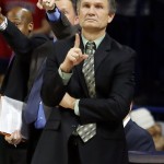 Utah Valley head coach Dick Hunsaker calls out the play during the first half of an NCAA college basketball game against Arizona, Tuesday, Dec. 9, 2014, in Tucson, Ariz. (AP Photo/Rick Scuteri)
