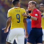 Referee Mark Geiger from the United States talks to Colombia's Teofilo Gutierrez during the group C World Cup soccer match between Colombia and Greece at the Mineirao Stadium in Belo Horizonte, Brazil, Saturday, June 14, 2014. (AP Photo/Jon Super)