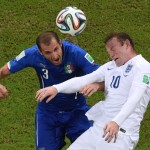  Italy's Giorgio Chiellini, left, and England's Wayne Rooney go for a header during the group D World Cup soccer match between England and Italy at the Arena da Amazonia in Manaus, Brazil, Saturday, June 14, 2014. (AP Photo/Francois Xavier Marit, pool)