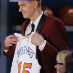 Kristaps Porzingis holds up a New York Knicks jersey after being selected fourth overall by the Knicks during the NBA basketball draft, Thursday, June 25, 2015, in New York. (AP Photo/Kathy Willens)
