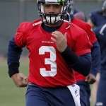 Seattle Seahawks' quarterback Russell Wilson runs drills during a team practice for NFL Super Bowl XLIX football game, Wednesday, Jan. 28, 2015, in Tempe, Ariz. The Seahawks play the New England Patriots in Super Bowl XLIX on Sunday, Feb. 1, 2015. (AP Photo/Matt York)
