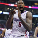 Los Angeles Clippers center DeAndre Jordan celebrates after scoring during the first half in Game 1 of an opening-round NBA basketball playoff series against the Golden State Warriors, Saturday, April 19, 2014, in Los Angeles. (AP Photo/Mark J. Terrill)
