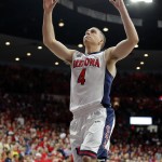 Arizona guard T.J. McConnell (4) reacts during the second half of an NCAA college basketball game against Michigan, Saturday, Dec. 13, 2014, in Tucson, Ariz. (AP Photo/Rick Scuteri)