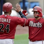Arizona Diamondbacks' Welington Castillo, right, is greeted by teammate Yasmany Tomas (24) after hitting a three-run home run against the San Diego Padres during the second inning of a baseball game Sunday, June 28, 2015, in San Diego. (AP Photo/Gregory Bull)
