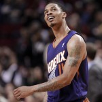  Phoenix Suns forward Gerald Green smiles as he checks the scoreboard late in the second half of an NBA basketball game against the Portland Trail Blazers in Portland, Ore., Friday, April 4, 2014. Green led the Suns with 32 points as they won 109-93. (AP Photo/Don Ryan)