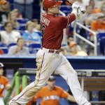 Arizona Diamondbacks' Mark Trumbo watches after hitting an RBI-double in the sixth inning during a baseball game against the Miami Marlins, Sunday, Aug. 17, 2014, in Miami. (AP Photo/Lynne Sladky)