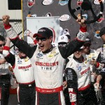 Joey Logano celebrates in victory lane after winning the NASCAR Xfinity Series auto race on Saturday, March 14, 2015, in Avondale, Ariz. (AP Photo/Rick Scuteri)