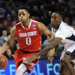Ohio State guard D'Angelo Russell, left, drives past Arizona forward Rondae Hollis-Jefferson during an NCAA college basketball tournament round of 32 game in Portland, Ore., Saturday, March 21, 2015. (AP Photo/Greg Wahl-Stephens)