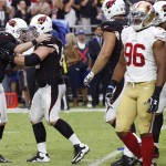 Arizona Cardinals' Chandler Catanzaro, left, celebrates a late-second-half field goal with Ted Larsen, as San Francisco 49ers' Corey Lemonier (96) walks off the field during an NFL football game Sunday, Sept. 21, 2014, in Glendale, Ariz. The Cardinals defeated the 49ers 23-14. (AP Photo/Ross D. Franklin)