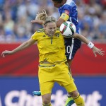 Sweden's Lisa Dahlkvist (7) and United States' Carli Lloyd (10) vie for the ball during FIFA Women's World Cup soccer action in Winnipeg, Manitoba, Canada, Friday, June 12, 2015. 