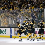  Fans and Boston Bruins players celebrate after Johnny Boychuk's (55) goal against the Montreal Canadiens during the third period in Game 1 of an NHL hockey second-round playoff series in Boston, Thursday, May 1, 2014. (AP Photo/Elise Amendola)