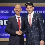 Nik Stauskas, right, poses for a photo with NBA Commissioner Adam Silver after being selected eighth overall by the Sacramento Kings during the 2014 NBA draft, Thursday, June 26, 2014, in New York. (AP Photo/Jason DeCrow)