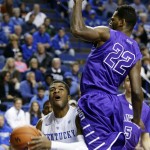 Kentucky's Andrew Harrison, left, looks for an opening against Grand Canyon's Royce Woolridge during the first half of an NCAA college basketball game, Friday, Nov. 14, 2014, in Lexington, Ky. (AP Photo/James Crisp)