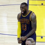 Cleveland Cavaliers forward LeBron James (23) celebrates after end of the overtime period of Game 2 of basketball's NBA Finals against the Golden State Warriors in Oakland, Calif., Sunday, June 7, 2015. The Cavaliers won 95-93 in overtime. (AP Photo/Eric Risberg)