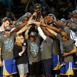 The members of the Golden State Warriors celebrate after winning the NBA Finals against the Cleveland Cavaliers in Cleveland, Wednesday, June 17, 2015. The Warriors defeated the Cavaliers 105-97 to win the best-of-seven game series 4-2. (AP Photo/Paul Sancya)
