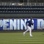 Kansas City Royals left fielder Alex Gordon (4) runs in for batting practice before an opening day baseball game against the Chicago White Sox at Kauffman Stadium in Kansas City, Mo., Monday, April 6, 2015. (AP Photo/Orlin Wagner)