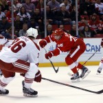 Detroit Red Wings right wing Tomas Jurco (26) shoots against the Arizona Coyotes during the second period of an NHL hockey game in Detroit on Tuesday, March 24, 2015. (AP Photo/Paul Sancya)