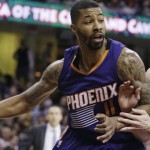 Phoenix Suns' Markieff Morris, left, drives past Cleveland Cavaliers' Kevin Love during the third quarter of an NBA basketball game Saturday, March 7, 2015, in Cleveland. The Cavaliers defeated the Suns 89-79. (AP Photo/Tony Dejak)