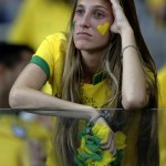 A Brazil supporter reacts during the World Cup semifinal soccer match between Brazil and Germany at the Mineirao Stadium in Belo Horizonte, Brazil, Tuesday, July 8, 2014. (AP Photo/Matthias Schrader)