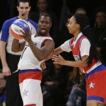 Mo'ne Davis, right, defends Kevin Hart during the first half of the NBA All-Star celebrity basketball game Friday, Feb. 13, 2015, in New York. (AP Photo/Frank Franklin II)