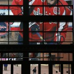 A large photo of Washington Capitals captain and All-Star Alex Ovechkin adorns the windows above and entrance to the Nationwide Arena for the NHL All-Star hockey weekend in Columbus, Ohio, Friday, Jan. 23, 2015. (AP Photo/Gene J. Puskar