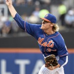 New York Mets pitcher Noah Syndergaard delivers the ball to an Arizona Diamondbacks batter during the first inning of a baseball game Friday, July 10, 2015, in New York. (AP Photo/Bill Kostroun)
