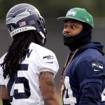 Seattle Seahawks' Marshawn Lynch, right, talks with Richard Sherman during a team practice for NFL Super Bowl XLIX football game, Thursday, Jan. 29, 2015, in Tempe, Ariz. The Seahawks play the New England Patriots in Super Bowl XLIX on Sunday, Feb. 1, 2015. (AP Photo/Matt York)