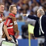 Germany's Bastian Schweinsteiger, left, comes off the pitch after getting injured during the World Cup final soccer match between Germany and Argentina at the Maracana Stadium in Rio de Janeiro, Brazil, Sunday, July 13, 2014. (AP Photo/Martin Meissner)