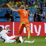 Netherlands' Arjen Robben (11) is fouled by Costa Rica's Junior Diaz (15) during the World Cup quarterfinal soccer match between the Netherlands and Costa Rica at the Arena Fonte Nova in Salvador, Brazil, Saturday, July 5, 2014. (AP Photo/Hassan Ammar)