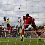 United States' goalkeeper Hope Solo (1) watches Alex Morgan (13), Carli Lloyd (10) and, Colombia's Catalina Usme (11) fight for the ball during second half FIFA Women's World Cup round of 16 soccer action in Edmonton, Alberta, Canada, Monday, June 22, 2015. (Jason Franson/The Canadian Press via AP)