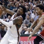Milwaukee Bucks' O.J. Mayo tries to drive past Chicago Bulls' Derrick Rose during the second half of Game 3 of an NBA basketball first-round playoff series Thursday, April 23, 2015, in Milwaukee. The Bulls won 113-106 in double overtime to take a 3-0 lead in the series. (AP Photo/Morry Gash)