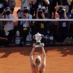 Russia's Maria Sharapova holds her trophy after winning the women's final match of the French Open tennis tournament against Romania's Simona Halep at the Roland Garros stadium, in Paris, France, Saturday, June 7, 2014. (AP Photo/Michel Spingler)