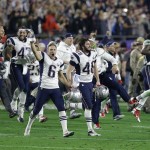 New England Patriots punter Ryan Allen (6), Danny Aiken (48) and teammates celebrate after the Patriots beat the Seattle Seahawks in the NFL Super Bowl XLIX football game Sunday, Feb. 1, 2015, in Glendale, Ariz. (AP Photo/Brynn Anderson)